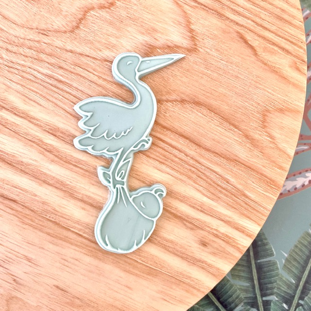 Emporte-pièce et tampon cigogne en vol pour livrer le bébé par l'illustratrice Tagamely,