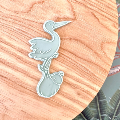 Emporte-pièce et tampon cigogne en vol pour livrer le bébé par l'illustratrice Tagamely,