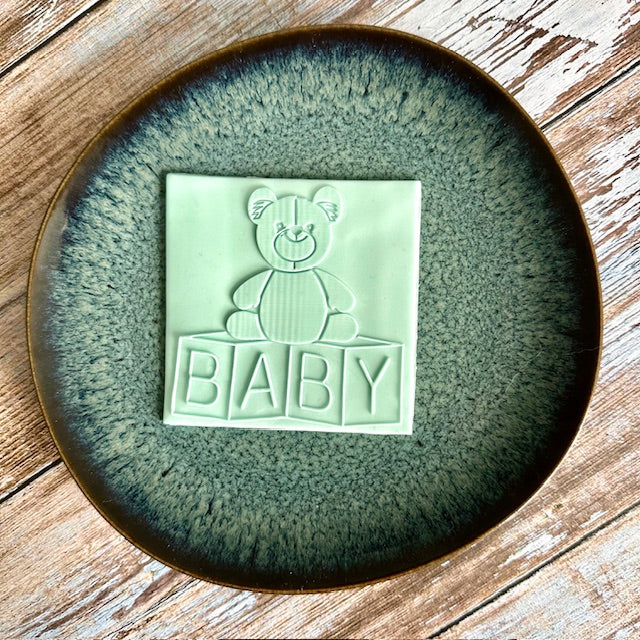 Teddy bear on cubes
