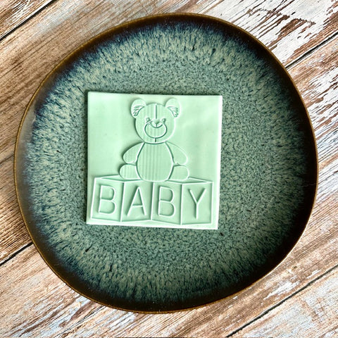 Teddy bear on cubes